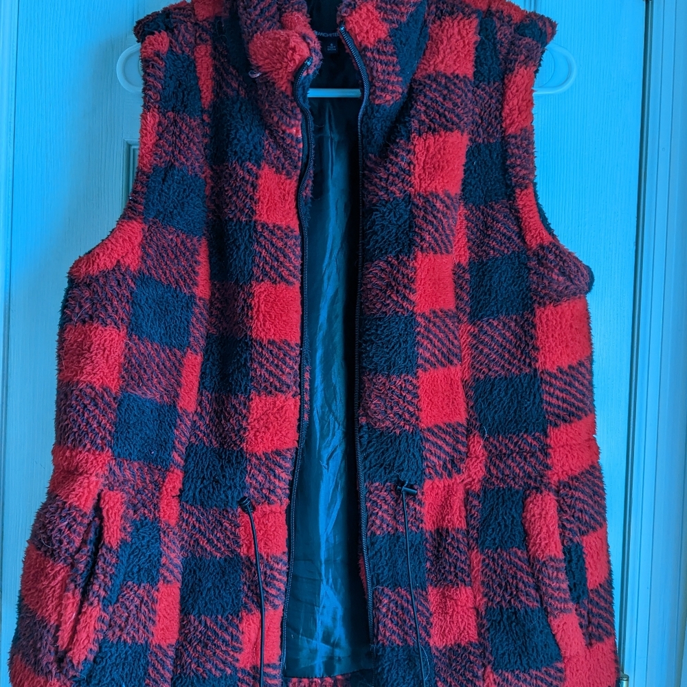 Buffalo plaid Sherpa fur vest.